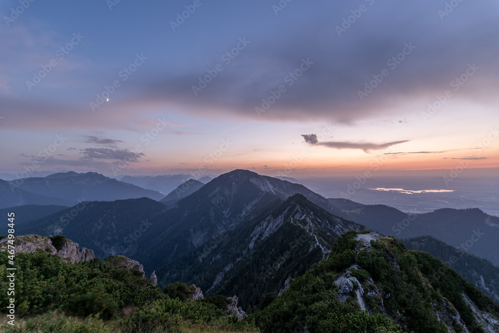 Colorful sunset in the alps. View from the peak of the Herzogstand in Bavaria Germany