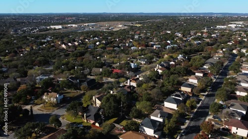 Drone footage of neighborhoods, homes, and streets in San Antonio, Texas.