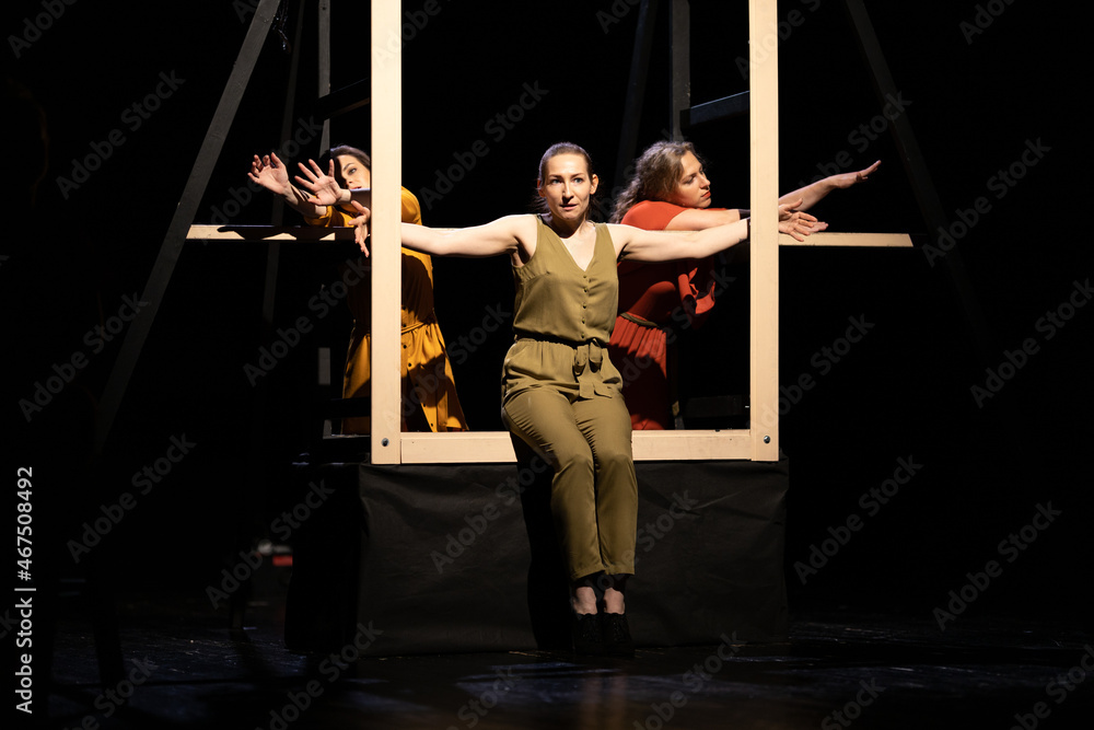 Actors and actresses perform a modern performance on the stage of the ...