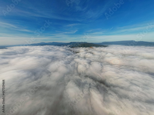 Clouds and sky over mountain from airplane window, Aerial view for nature background