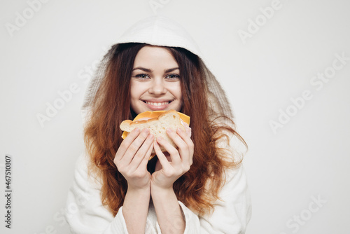 cheerful woman eating sandwich snack fast food