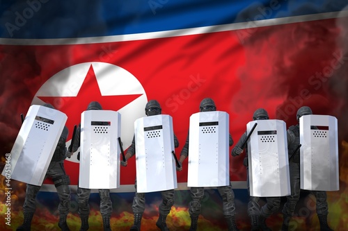 North Korea protest stopping concept, police guards in heavy smoke and fire protecting peaceful people against mutiny - military 3D Illustration on flag background