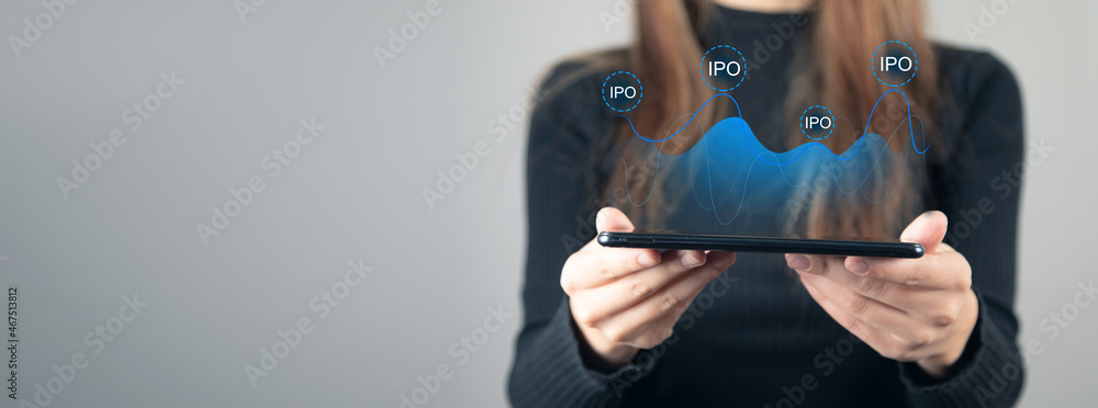 Businesswoman using tablet, IPO hologram Businesswoman using tablet, IPO hologram