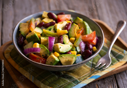 Avocado salad with other vegetables, tomatoes and corn. Healthy food