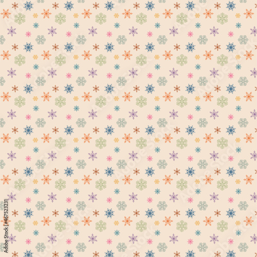Vector festive image with a pattern of multicolored snowflakes on a delicate beige background