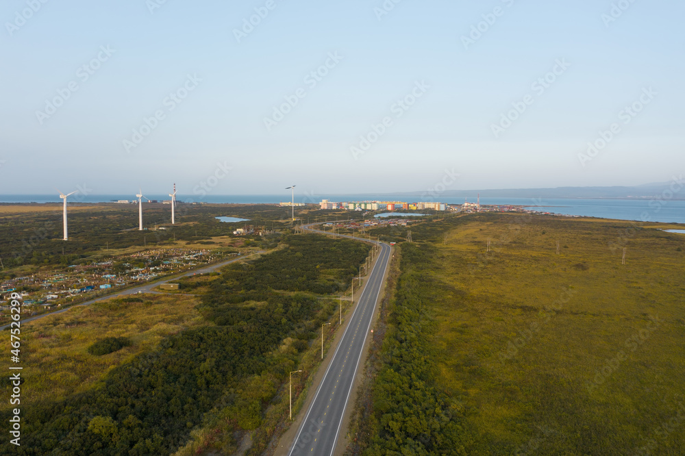 Windmills, road, city on the ocean Ust-Kamchatsk, Kamchtka