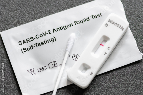 Negative Covid-19 antigen test kit, one step coronavirus antigen rapid test, saliva swab, 1 test box with imagine of lungs, close up photo