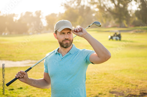 portrait of golfer in cap with golf club in cap, sport