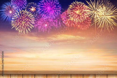 Wood table floor and Amazing Beautiful firework on sky clouds background for celebration anniversary merry christmas eve and happy new year