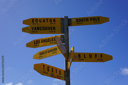 Yellow direction sign post in the northern point of New Zealand Cape Reinga