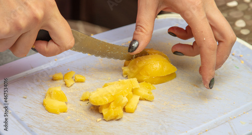 The process of slicing boiled potatoes