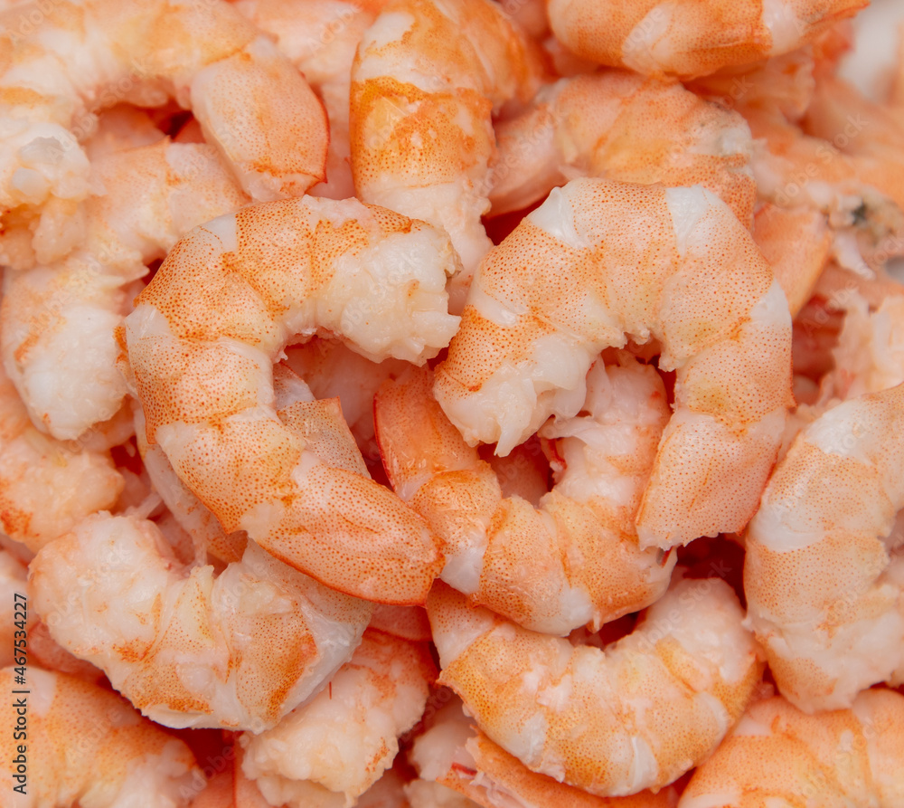 Peeled red shrimp meat as background. Peeled red shrimp meat as background.