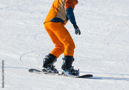 A man is snowboarding in the snow