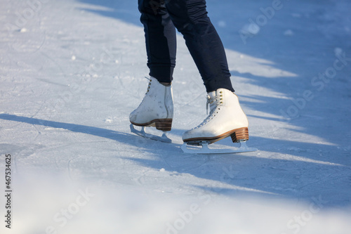 White skates on the legs of the girl