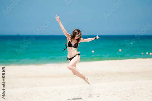 Girl Jumping when running on the beach ( Summer Vibes ) welocme to troipcs photo