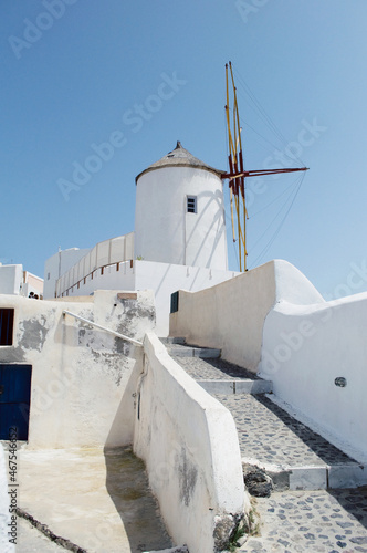 GREECE, SANTORINI: Scenic seaside landscape view of white classics buildings on the rocky slopes of Thira island 
