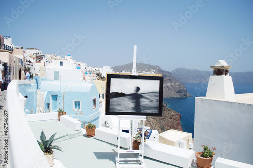 GREECE, SANTORINI: Scenic seaside landscape view of white classics buildings on the rocky slopes of Thira island   © Marry