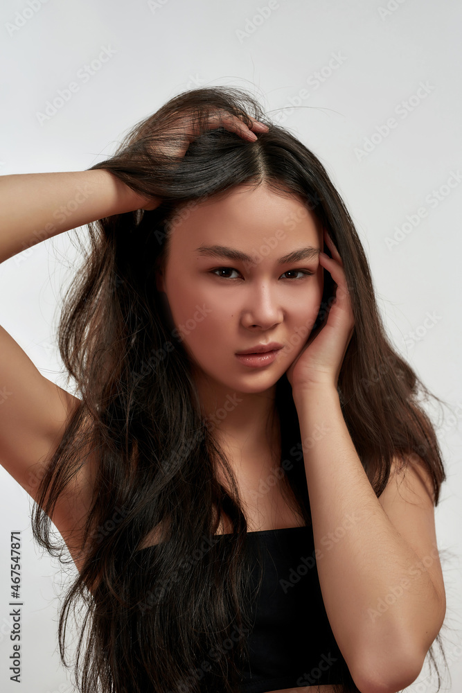 Portrait of young Asian woman flirting at camera Portrait of young Asian woman flirting at camera