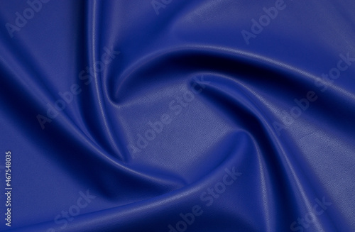 blue artificial leather with waves and folds on PVC base