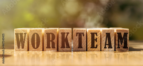 Photos the text WORKTEAM on wooden cubes on light background