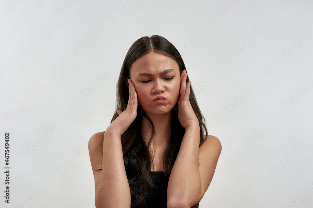 Unhappy Vietnamese girl suffer from problems thinking Unhappy Vietnamese girl suffer from problems thinking
