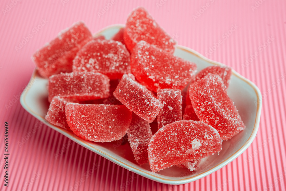 Dessert marmalade in the form of lemon and orange slices. The sweetness of jelly candy. Dessert marmalade in the form of lemon and orange slices. The sweetness of jelly candy.