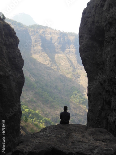 A person sitting on a rock - Relax