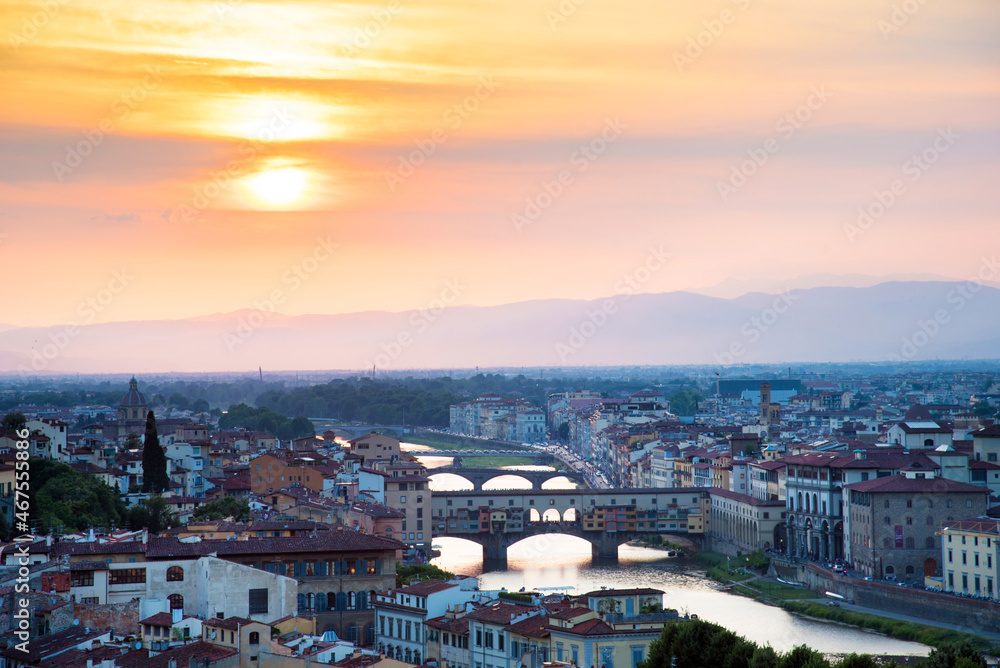 Famous bridges over the Arno river in Florence, Italy, at the dawn of the sun. Fantastic romantic landscape.