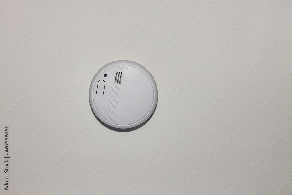 Fototapeta premium View of white home smoke alarm detector isolated. Security system concept. Sweden.