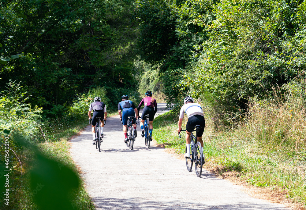 Group of cyclists going up a mountain road. Group of cyclists going up a mountain road.