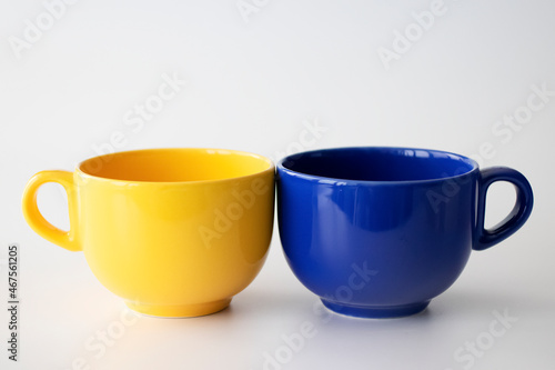 Blue and yellow cup on a light background. photo