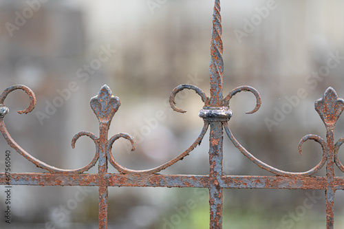 Selective focus shot of an old rusty metal fence photo