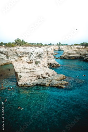 a great view on faraglioni di sant'andrea in puglia