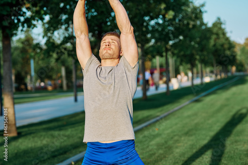 athletic man in the park workout jogging exercise summer