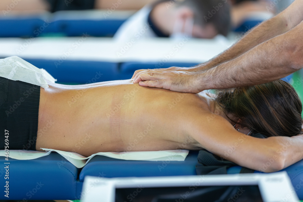 Athlete's Back Massage after Fitness Activity -  Wellness and Sport