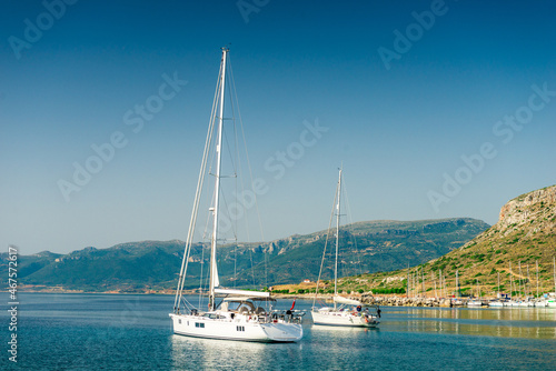 boats sway on the turquoise waves of the Ionian sea of Greece in sunny weather