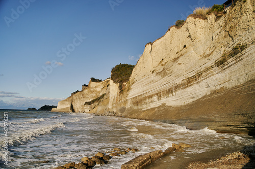 View of Logas Beach and the amazing rocky cliff in Peroulades. Corfu island. Greece