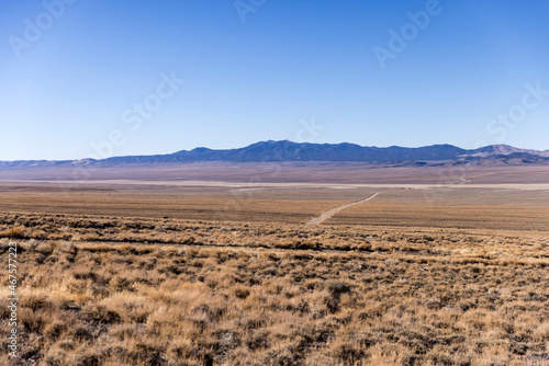 Wide open landscape desert scene with valley and mountains