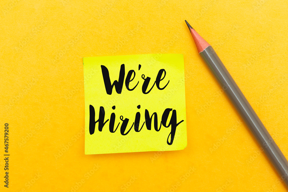 we are hiring concept on sticky note with pencil isolated on yellow background we are hiring concept on sticky note with pencil isolated on yellow background