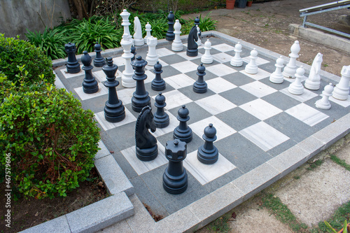 Giant chess in the park. Playing chess in the park.