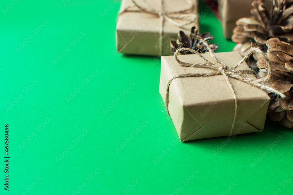 Festive concept - a gift with a bow and cones on a green and red background. composition for christmas, new year and holidays. flat lay with place for text.
Festive concept - a gift with a bow and cones on a green and red background. composition for christmas, new year and holidays. flat lay with place for text.