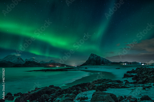 Aurora Borealis, the Northern lights on sky in Lofoten islands, northern Norway