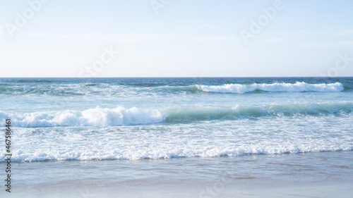 Raging ocean waves. Raging waters. White bureaucratic waves of the sea. Abstract blue sea water with white wave
