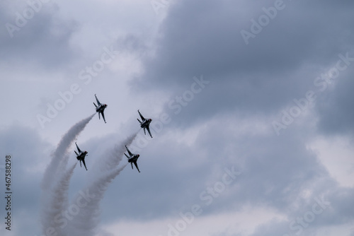 Group of flying aircraft against a cloudy sky during the National Air Show in Cleveland, USA