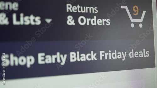 Close up icon of shopping cart icon on computer screen with counting numbers  on shopping web page. Black Friday.
