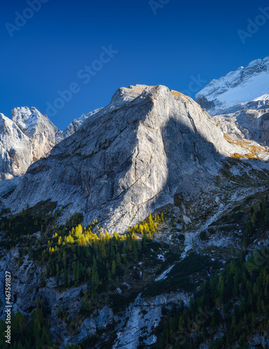 High sharp rocks and forest. Mountain valley before sunset. Natural landscape...