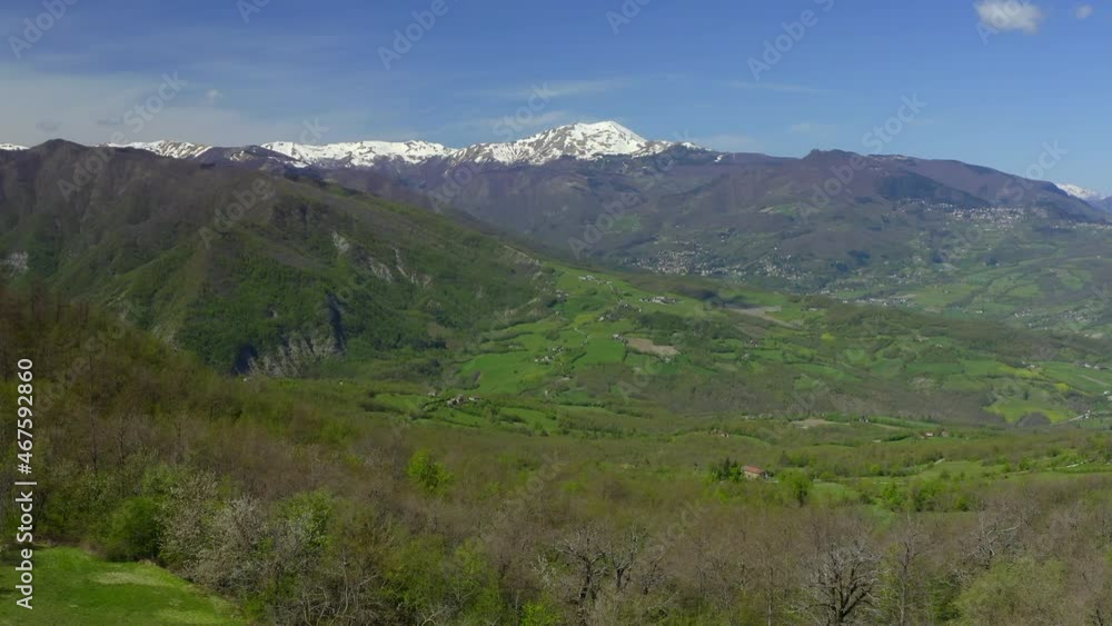 Aerial: Scenic View Of Snowcapped Mountains Against Sky, Drone Flying Forward Over Green Landscape - Apennine Mountains, Italy Aerial: Scenic View Of Snowcapped Mountains Against Sky, Drone Flying Forward Over Green Landscape - Apennine Mountains, Italy