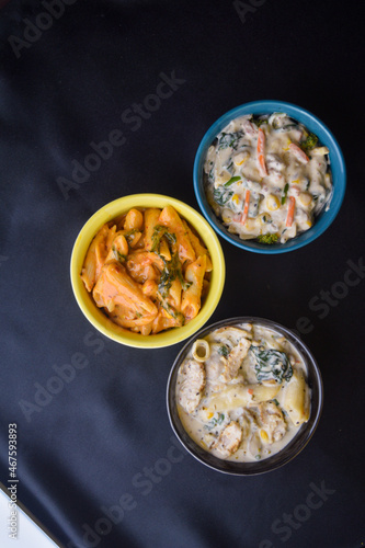 Different types of pasta in bowls