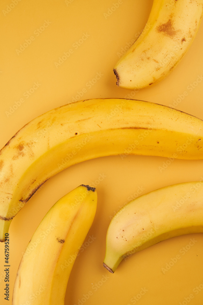 Bananas yellow background with copy space
