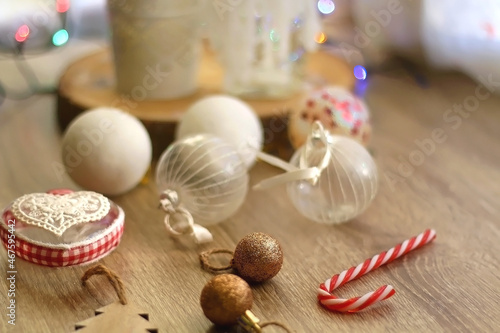 Various Christmas ornaments, candles and colorful bokeh lights. Selective focus.